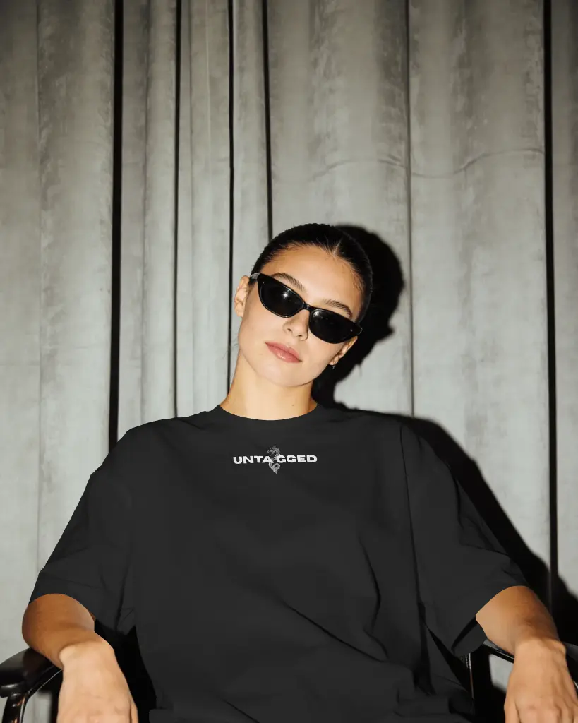 editorial-t-shirt-mockup-on-model-with-moody-lighting-and-draped-backdrop-shadow-contrast-03938.webp